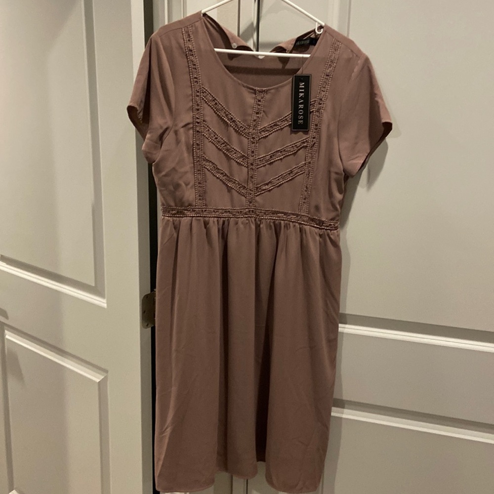 Tan dress with tags. Size Large